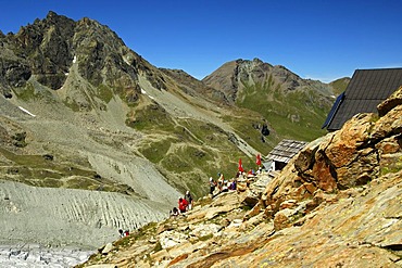 Hikers at the Moiry Hut, Pennine Alps, Valais, Switzerland, Europe