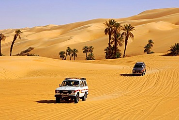 Toyota jeep on a desert road in the Mandara valley, Ubari Sand Sea, Sahara, Libya, Africa