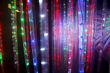 Maze, labyrinth made of colorful illuminated light rods, at a fair