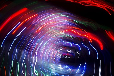 Maze, labyrinth made of colorful illuminated light rods, at a fair