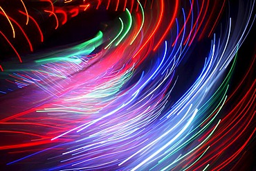 Maze, labyrinth made of colorful illuminated light rods, at a fair