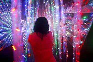 Maze, labyrinth made of colorful illuminated light rods, at a fair