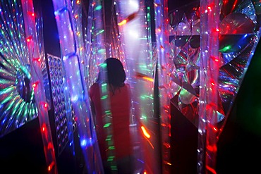 Maze, labyrinth made of colorful illuminated light rods, at a fair