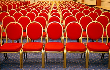 Conference room with red chairs in a row