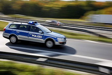 Police patrol car with flashing lights, Germany, Europe