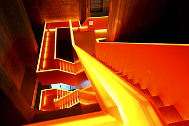 Red illuminated main staircase in the new Ruhrmuseum museum, opened in January 2010, Capital of Culture year, in the former coal washing plant of the Zeche Zollverein mine, World Heritage Site, Essen, North Rhine-Westphalia, Germany, Europe