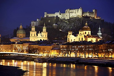 Old town with Kollegienkirche church, the Salzburger Dom cathedral and Festung Hohensalzburg fortress, Salzach river, in the evening, winter, Salzburg, Austria, Europe