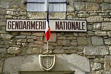 Gendarmerie with flag, fortified cliff town Rocamadour, Departement Lot, Midi-Pyrenees, France, Europe