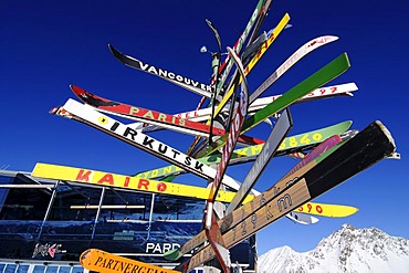 Signpost made of old skis with distances to various cities, Pardorama mountain restaurant, Ischgl ski resort, Tyrol, Austria, Europe