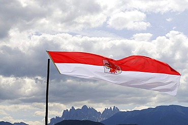 State flag fluttering over the Odle group, Dolomites, South Tyrolean eagle, South Tyrol, Italy, Europe