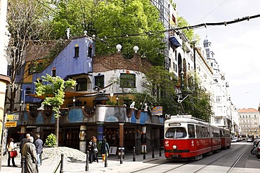 Tram passing Hundertwasserhaus by Friedensreich Hundertwasser, Vienna, Austria, Europe