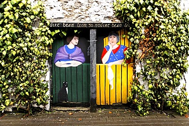 Painting of two women on wooden doors, Killarney, Ireland, Europe