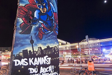 Potsdamer Platz with a piece of the wall at night, Berlin, Germany, Europe