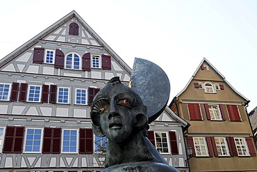 In the front the Mondscheinbrunnen fountain, bronze by Juergen Goertz, 1991, in the back the protestanc city church, Schorndorf, Baden-Wuerttemberg, Germany, Europe