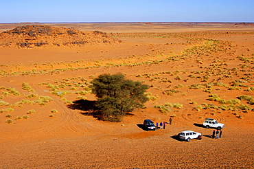 Three jeeps with tourists lost on a trip in the depths of the Sahara, Libya, Africa