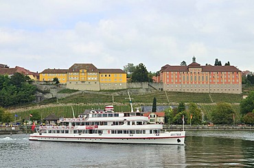 A boat in Meersburg harbour in front of the State Vineyards and Droste Huelshoff Gymnasium high school, Lake Constance, Baden-Wuerttemberg, Germany, Europe