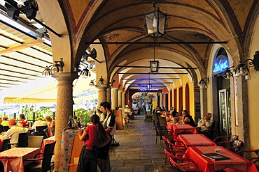 Arcades along the promenade with street restaurants, Lago Maggiore, Cannobio, Piedmont, Italy, Europe