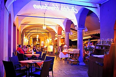 Arcades along the promenade with street restaurants, Lago Maggiore, Cannobio, Piedmont, Italy, Europe