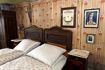 Farmer's bed-room with double bed, pictures of saints on the wall, Haus Haeusing house, farm from 1734, Wolfegg farmhouse museum, Allgaeu region, Upper Swabia, Baden-Wuerttemberg, Germany, Europe