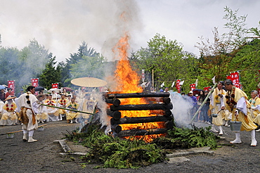 Yamabushi followers, mountain ascetics, Buddhist sect, pushing cedar branches off the fire with bamboo poles, Iwakura, Japan, East Asia, Asia