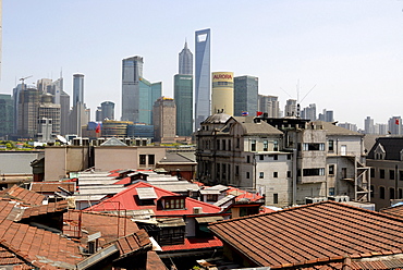 Old and new, view over the historic city centre of Shanghai and The Bund towards the skyline of the Pudong financial district with Jin Mao Tower and the World Finance Building across the Huangpu River, Shanghai, China, Asia