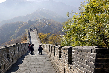 People walking over the Great Wall of China near Mutianyu, autumnal colours, near Beijing, China, Asia