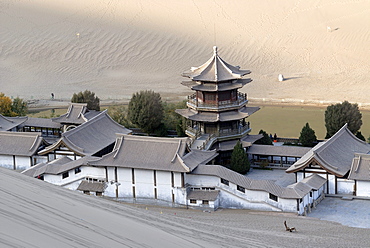 View from the sand dunes of the Gobi Desert over the Crescent Lake with the Chinese Pagoda in Dunhuang, Silk Road, Gansu, China, Asia