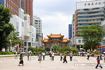 Busy pedestrian zone in the modern city center, Kunming, Yunnan Province, People's Republic of China, Asia