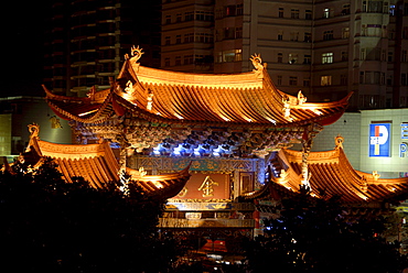 Chinese gate at night in the city center, Jinmabiji square, Kunming, Yunnan Province, People's Republic of China, Asia