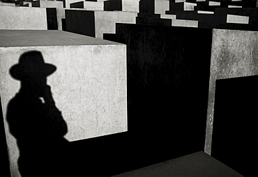 Shadow of a person wearing a hat, Stelae Field, Holocaust Memorial, Berlin, Brandenburg, Germany, Europe