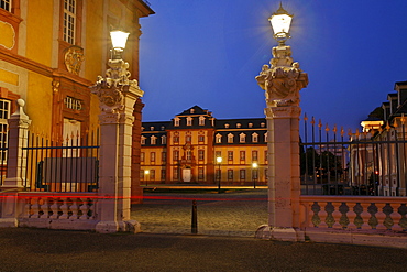 Entrance to Bruchsal Castle with lanterns on the gate at twilight, Bruchsal, Baden-Wuerttemberg, Germany, Europe