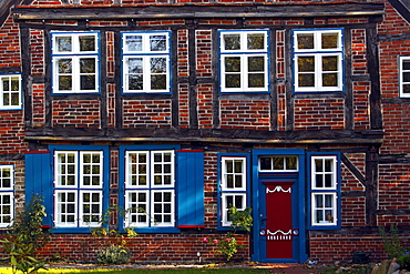 Old half-timbered house with decorative wooden door at the cathedral court, former organist's house of the Ratzeburg cathedral, Ratzeburg, Kreis Herzogtum Lauenburg district, Schleswig-Holstein, Germany, Europe