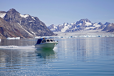 Transportation boat in the Sermiligaq fjord, in the back the Knud Rasmussen Glacier, East Greenland, Greenland, Denmark