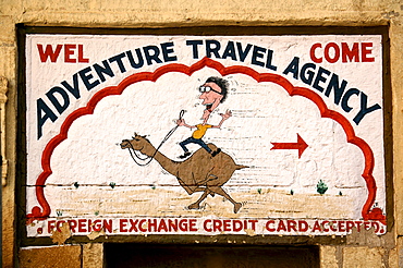 Advertising sign of an Indian travel agent for a camel safari in Jaisalmer, Rajasthan, India, Asia