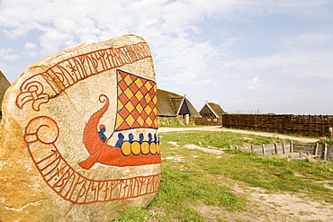 Inscription and a Viking boat on a rune stone, at the Viking Museum in Bork on Ringkoebing Fjord, West Jutland, Denmark, Europe