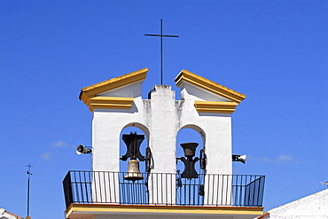 Bell tower of a church against a blue sky, Olvera, Andalusia, Spain, Europe