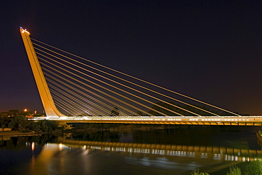 Alamillo Bridge, Puente del Alamillo, over Guadalquivir River, at night, built as part of infrastructure improvements for Expo 92, Seville, Spain, Europe