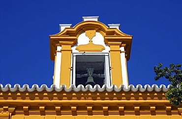 A colorful dormer with a bell, Seville, Spain, Europe