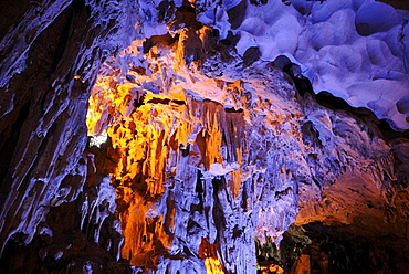 Colorful illuminated cave at Halong Bay, UNESCO World Heritage Site, Vietnam, Asia