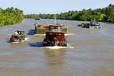 Ships and boats on the Mekong River, Vietnam, Asia