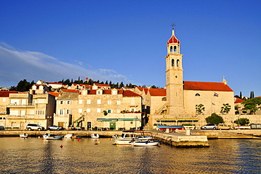 Fishing boats in the harbor of Sutivan in front of the church Sveti Ivan, Island Brac, Dalmatia, Croatia, Balkans, Europe