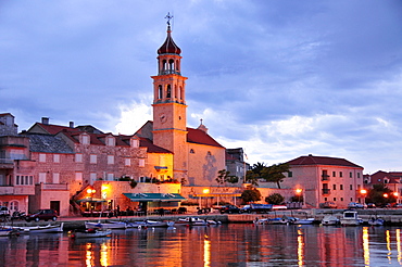 Fishing boats in the harbor of Sutivan in front of the church Sveti Ivan, Island Brac, Dalmatia, Croatia, Balkans, Europe