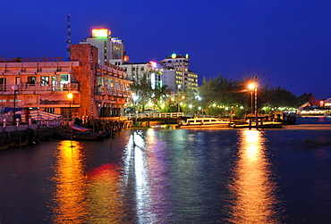 Lighted Houses in Can Tho in the evening reflections on the Mekong, Mekong Delta, Vietnam, Southeast Asia