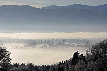 View from Schlossberg Mountain of Loisachtal Valley, wintery impressions with the two church towers from Breuerberg, St Peter and Paul parish church, Marienkirche Church, now cemetery church, Eurasburg, Bavaria, Germany