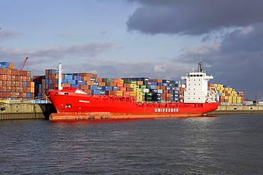 Feeder vessel, freight ship and container in Hamburg harbour, Hamburg, Germany