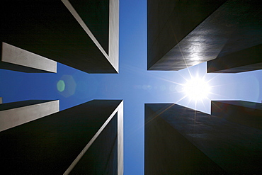 Sun over the concrete slabs or stelae at the Memorial to the Murdered Jews of Europe, Berlin, Germany, Europe