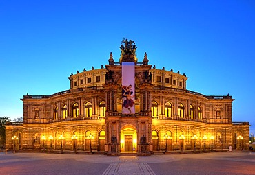 Semperoper Opera house with flags and illuminated at night, Theaterplatz square, Dresden, Free State of Saxony, Germany, Europe