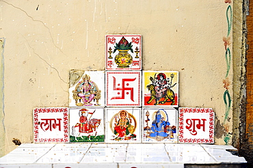 Tiles with Indian, Hindu deities and the Swastika for good luck, Sunrise icon, Jaisalmer, Rajasthan, North India, India, South Asia, Asia