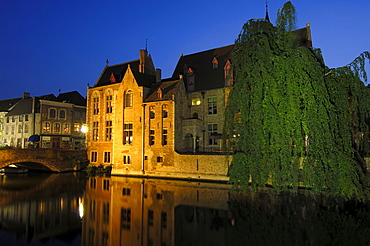 Water reflection on River Dijver at dusk, Bruges, Flanders, Belgium, Europe