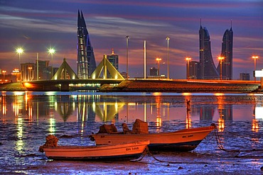 Skyline of the Corniche as seen from King Faisal Highway, Muharraq side, World Trade Center buildings, left, beside the towers of the Financial Harbour Complex, Muharriq Bridge at the Sheikh Isa Causeway, capital city, Manama, Kingdom of Bahrain, Persian 